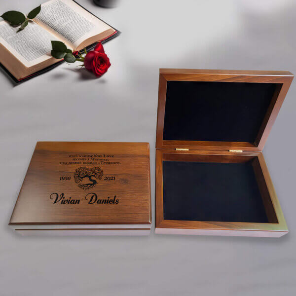 Engraved wooden box designed for memorial gifts, featuring a polished finish and intricate detailing for cherished keepsakes.